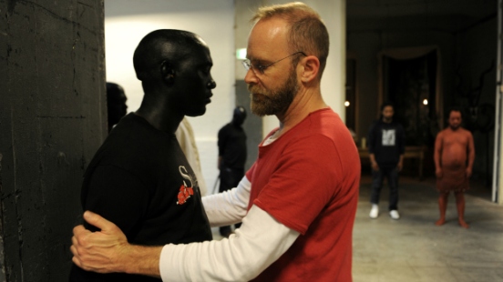 South African artist/director Brett Bailey seen here positioning a performer Photo credit: Sofie Knijff